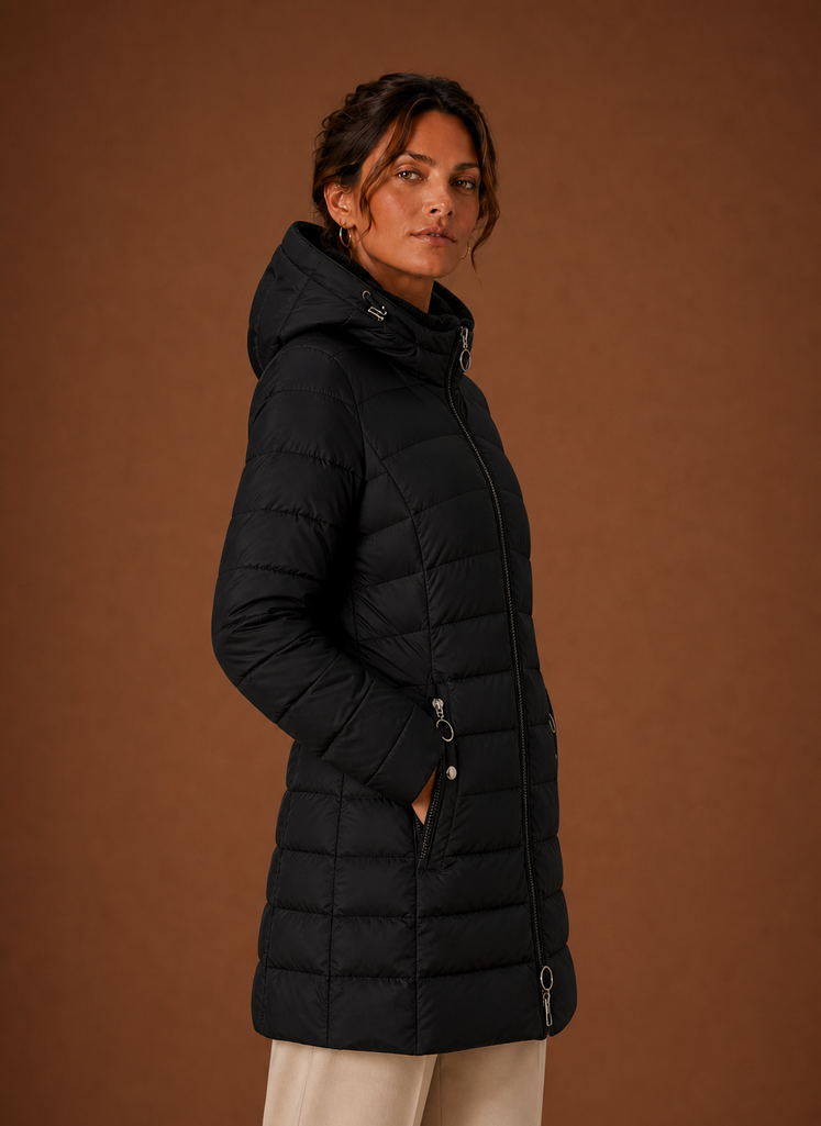 Side profile of women's long black puffer coat showing hood and silhouette