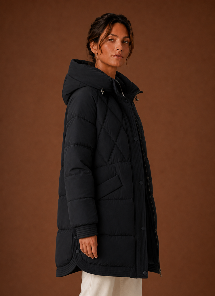Side profile of the hooded longline puffer jacket showing length and silhouette