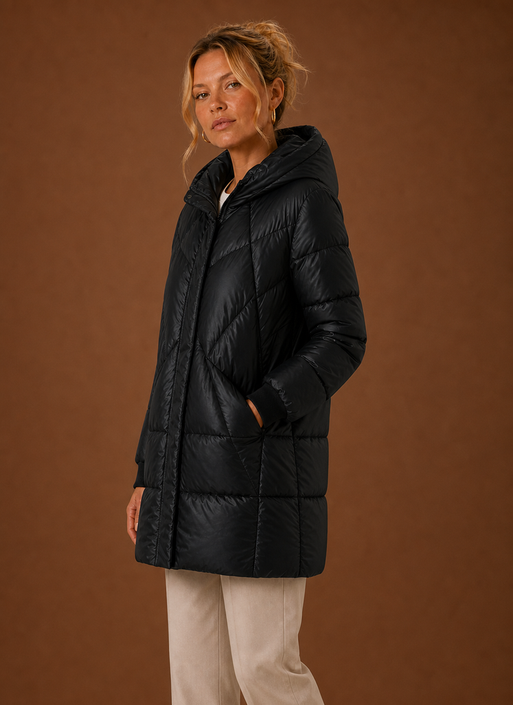 Side profile of the Areleon long puffer jacket with hood, highlighting the long cut and hooded neckline