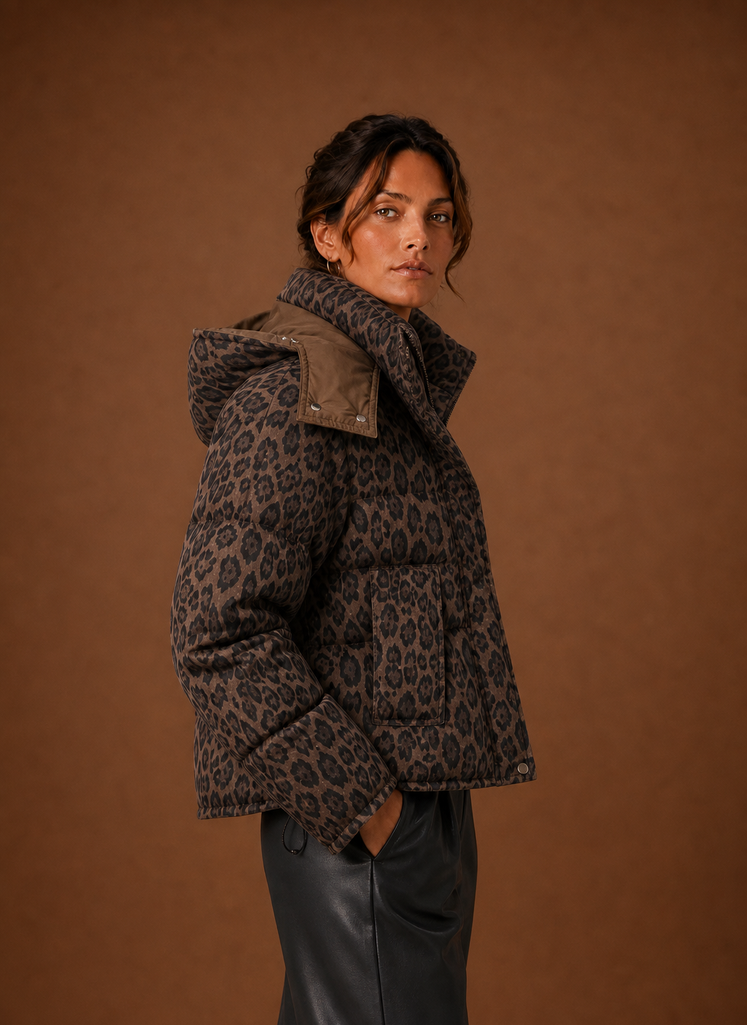 Side view of women's leopard puffer jacket in burgundy highlighting profile and fit