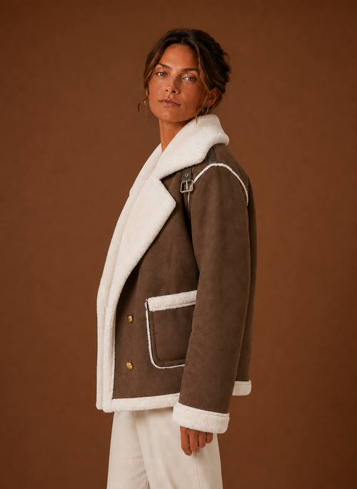 Side view of women's aviator jacket displaying silhouette and sleeve fit