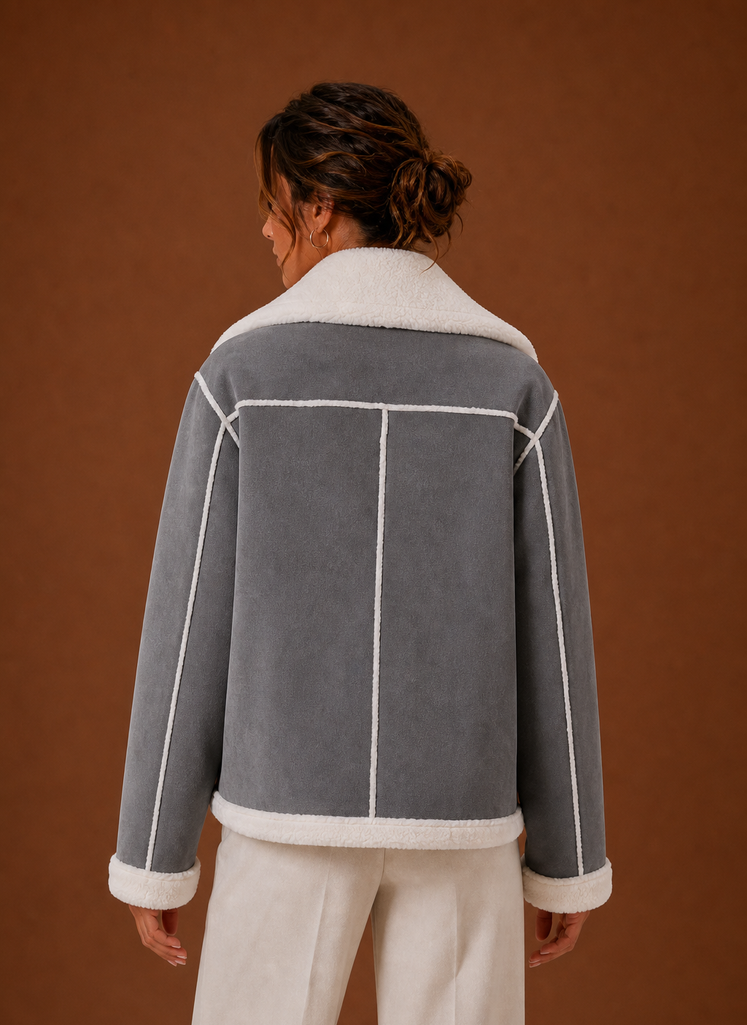 Back view of women's aviator jacket highlighting the streamlined back and hem